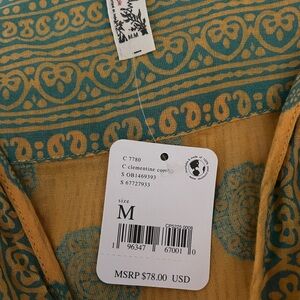 Free people new with tags, yellow, and blue bodysuit size medium